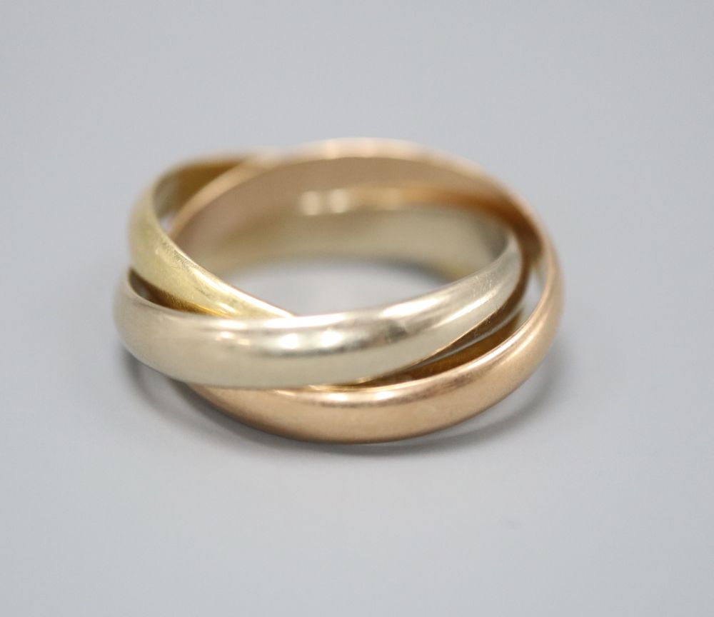 A Must de Cartier three colour 18ct gold Russian triple band wedding ring, numbered 0 6373 L, size M, 8.3 grams